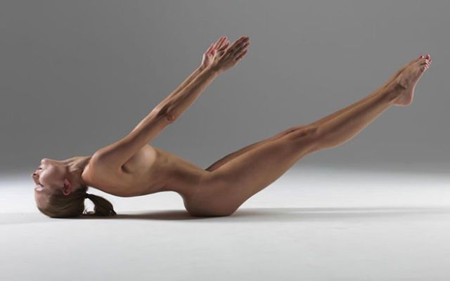 Modern body movement image of naked fitness model.