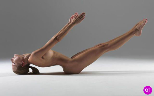 Naked fitness for beginners model doing nude exercise from the back an side.